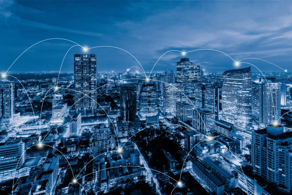 Digital network connection lines of Sathorn, Bangkok Downtown, skyline of Thailand. Financial district and business centers in smart urban city in Asia. Skyscraper and high-rise buildings at night.